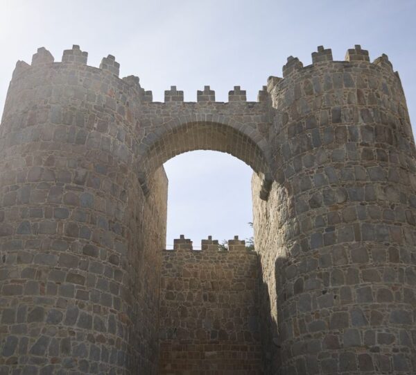 Stone archway gate in the medieval walls of Ávila, Spain