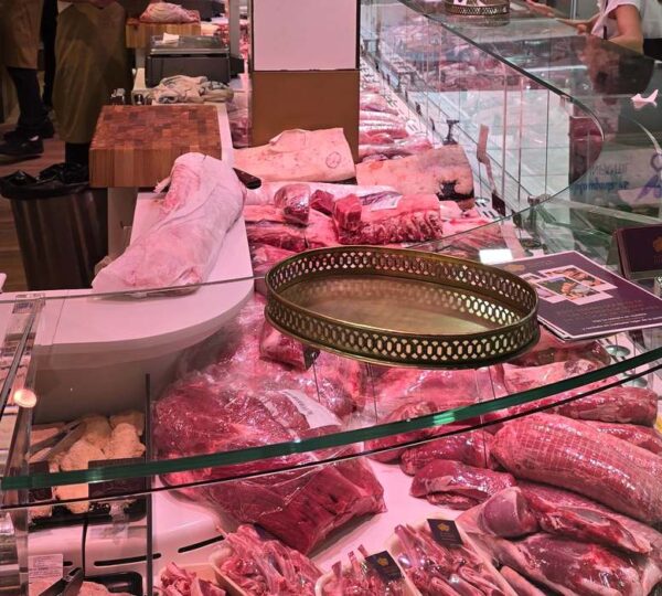 Iberian ham and meat counter at a market in the Salamanca district of Madrid