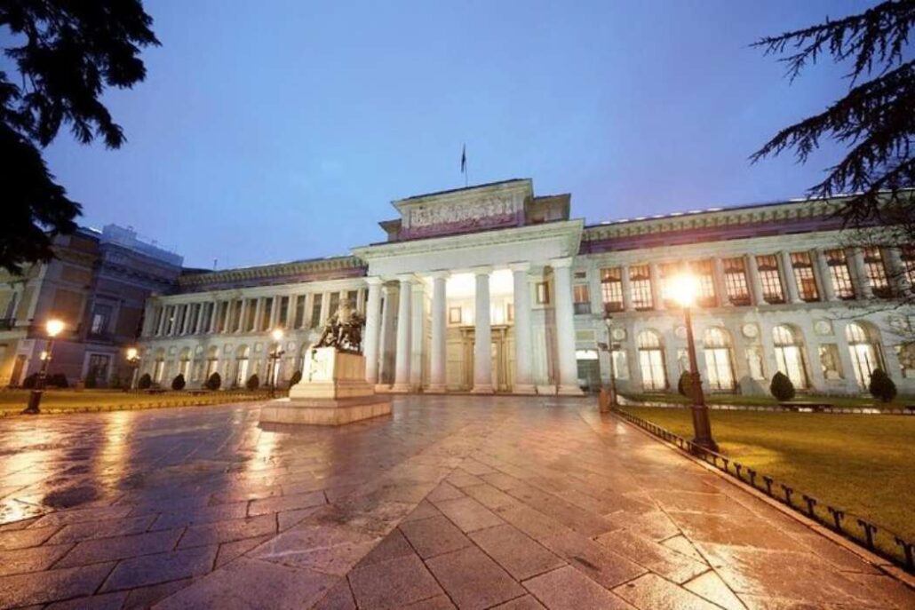 Prado Museum facade at twilight in Madrid