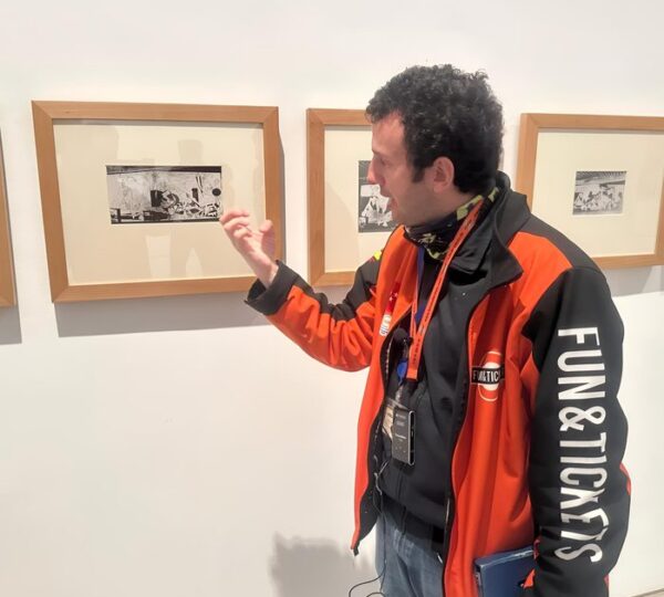 Guide explaining Picasso's etchings related to Guernica at the Reina Sofía Museum