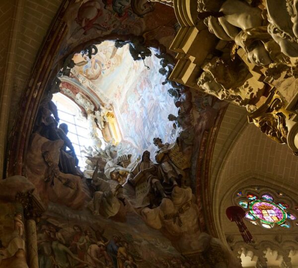 Gothic vaulted ceiling and rose window inside Toledo Cathedral