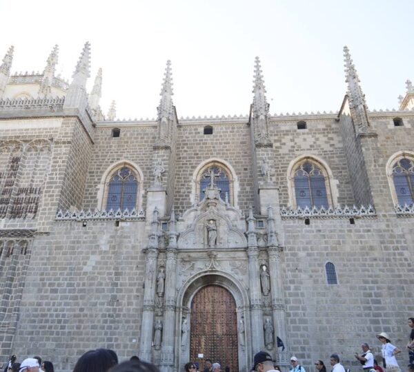 Visitors outside the Monastery of San Juan de los Reyes in Toledo